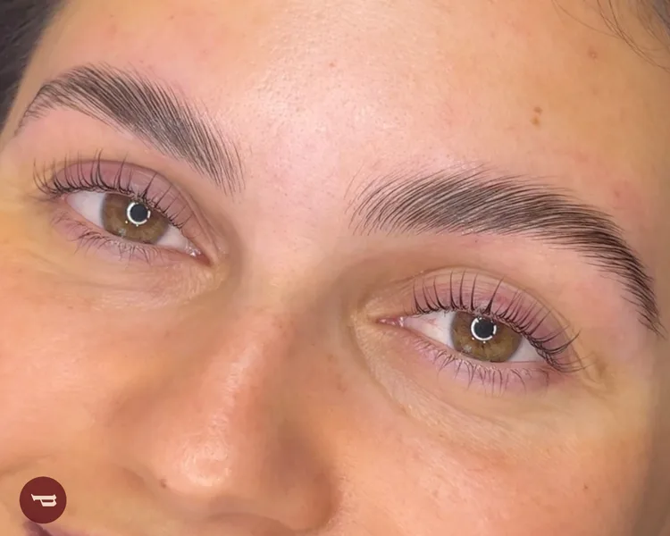 Brow tint and lamination result — both brows defined and full