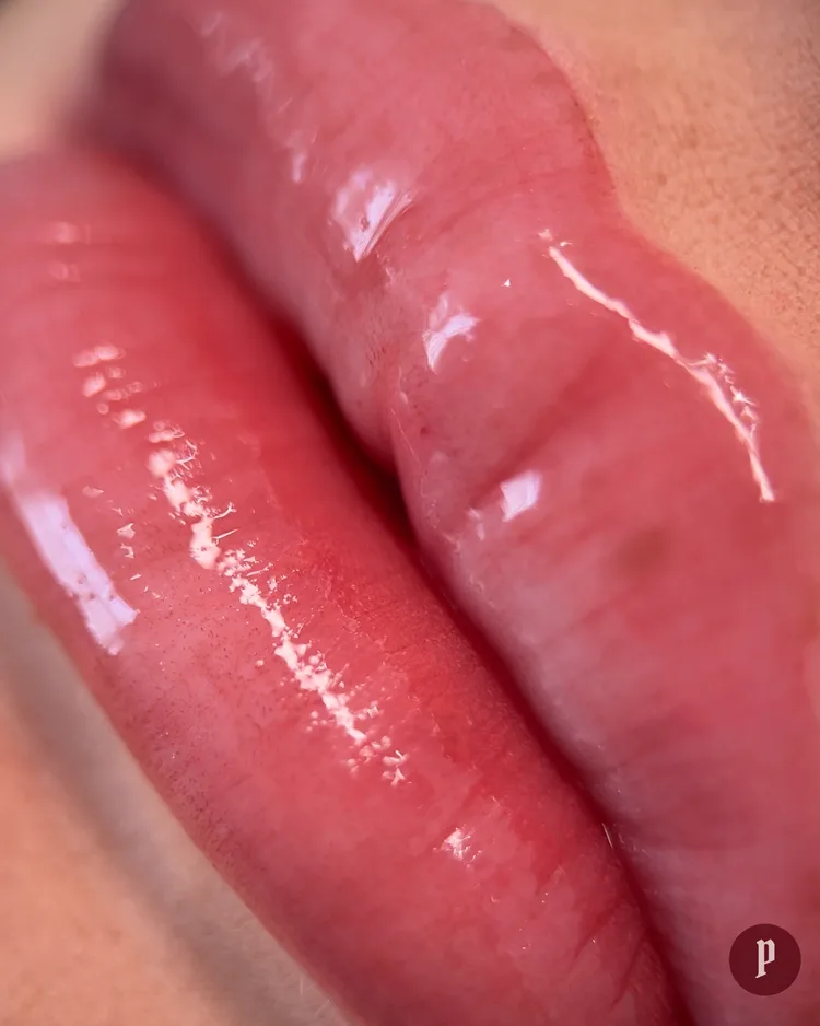 Fresh lip blush tattoo result — warm rosy pink, glossy and defined
