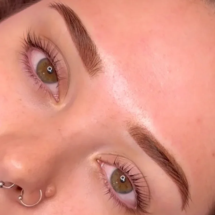 Brow lamination result — both eyes and brows, full nose-ring partial face